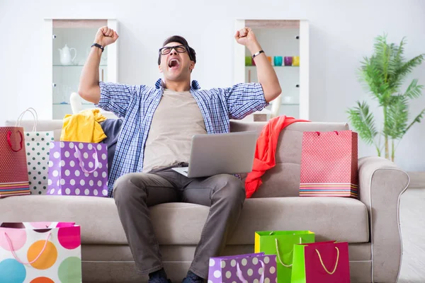 Young man buying clothing online and running blog — Stock Photo, Image