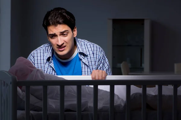 Young father under stress due to baby crying at night — Stock Photo, Image