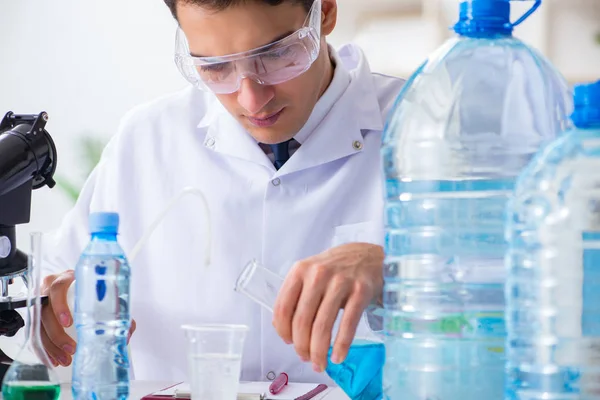 Lab assistant testing water quality