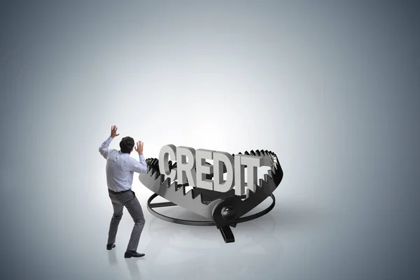 Businessman falling into the trap of loan credit — Stock Photo, Image