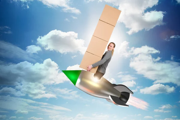 Woman flying rocket and delivering boxes — Stock Photo, Image