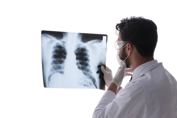 Young doctor looking at x-ray images isolated on white — Stock Photo, Image