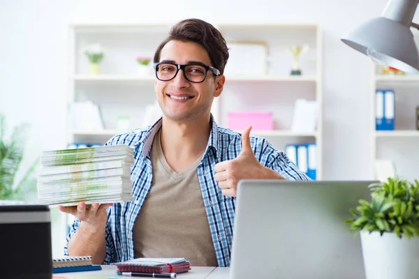 Sales assistant at publishing house showing ready printed books