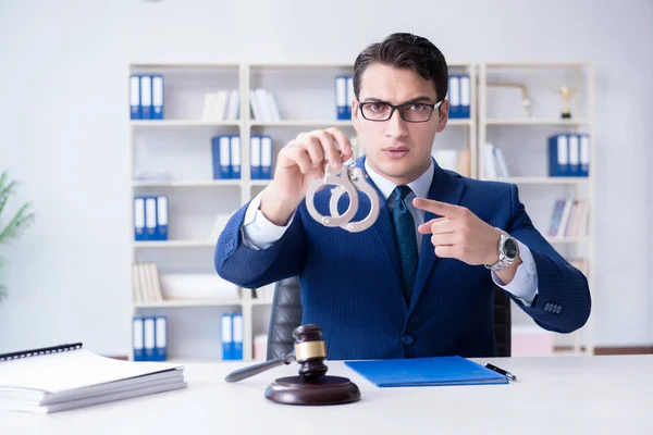 Young lawyer judge sitting in the office