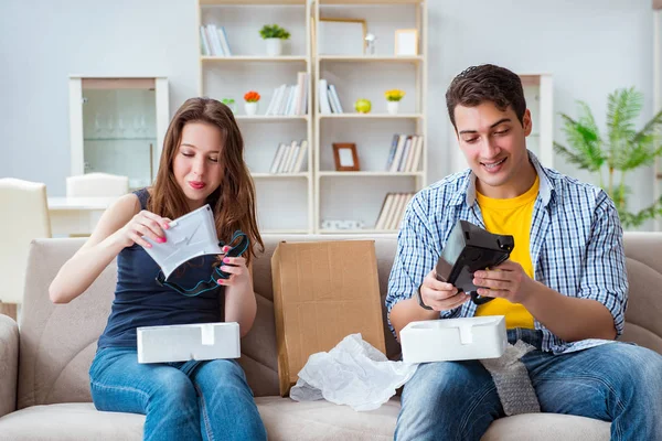 Young family playing games with virtual reality glasses