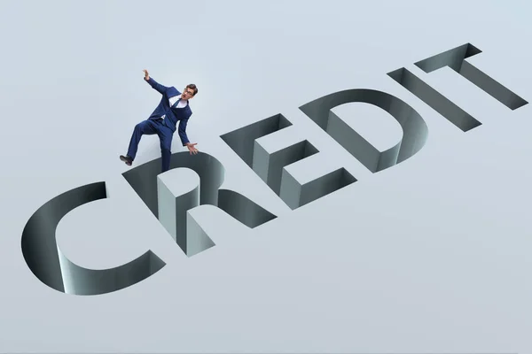 Businessman falling into trap of borrowing debt and credit — Stock Photo, Image