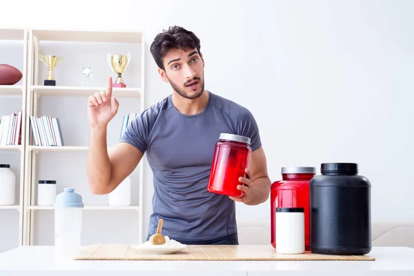 Athlete tasting new protein supplements for better muscles — Stock Photo, Image