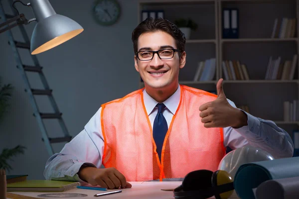 Construction architect working on drawings late at night — Stock Photo, Image