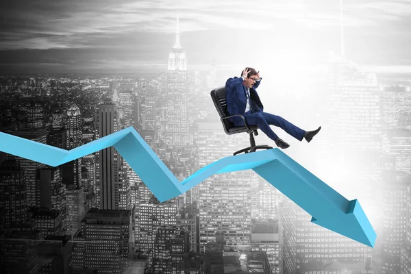 Businessman sliding down on chair in economic crisis concept — Stock Photo, Image