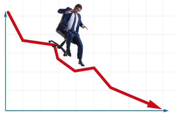 Businessman sliding down on chair in economic crisis concept — Stock Photo, Image