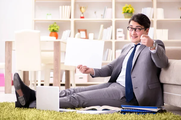 Businessman working on the floor at home — Stock Photo, Image