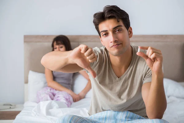 Man suffering from impotency with pill — Stock Photo, Image