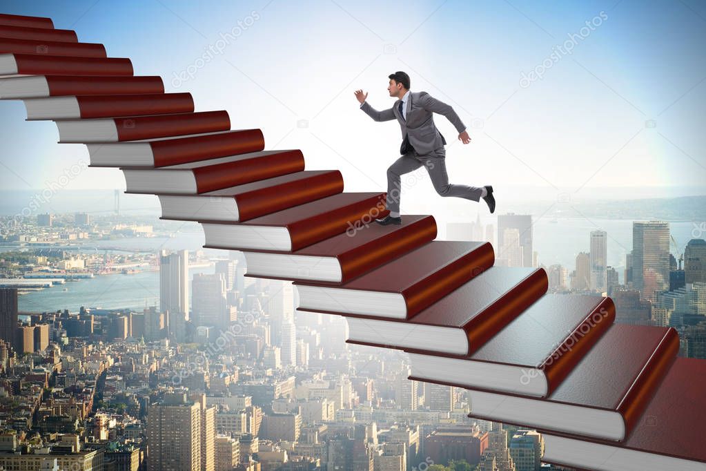 Businessman student climbing the ladder of education books