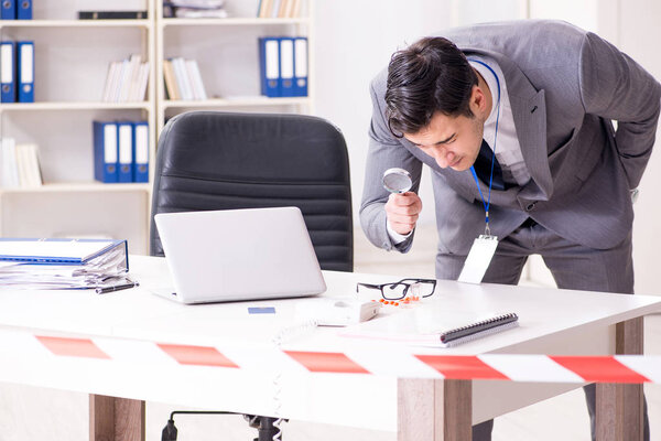 Forensics investigator at the scene of office crime