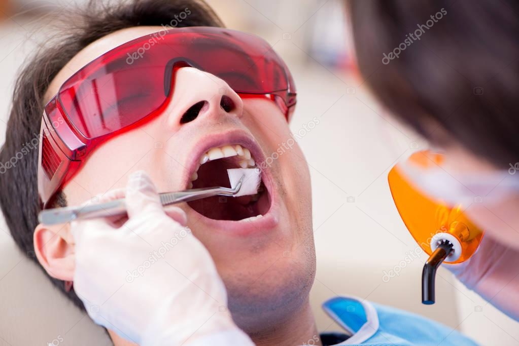 Patient visiting dentist for regular check-up and filling