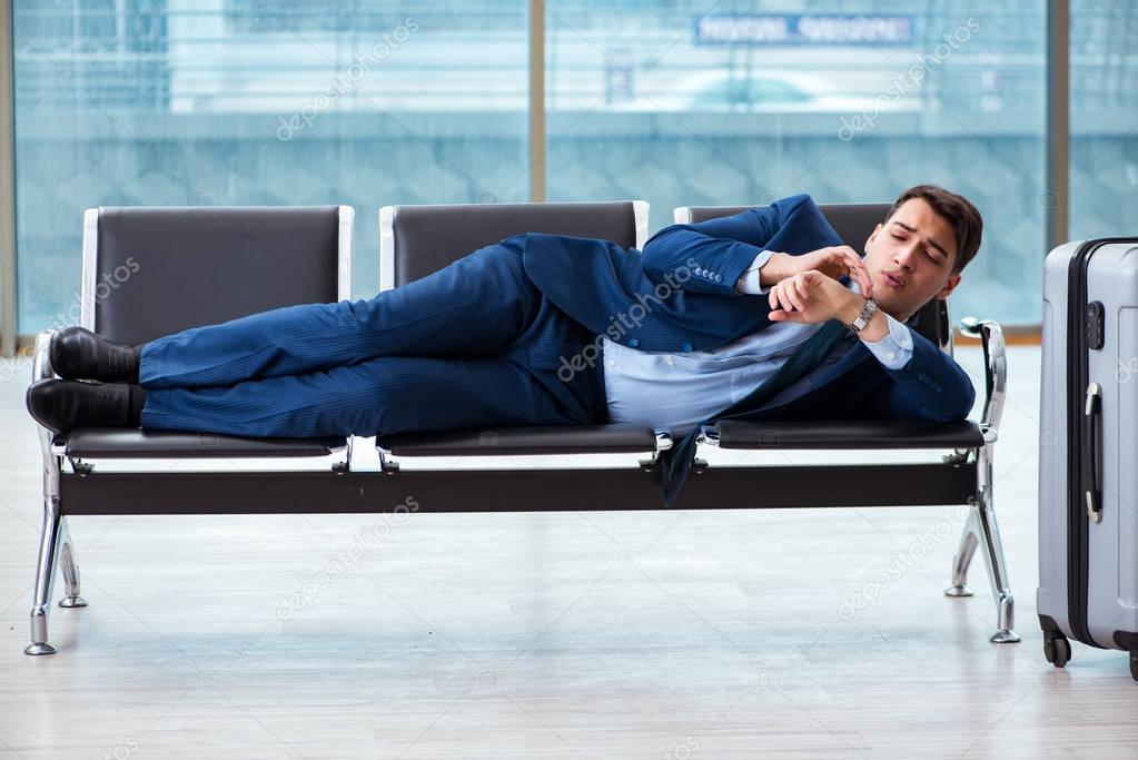 Businessman waiting at the airport for his plane in business cla