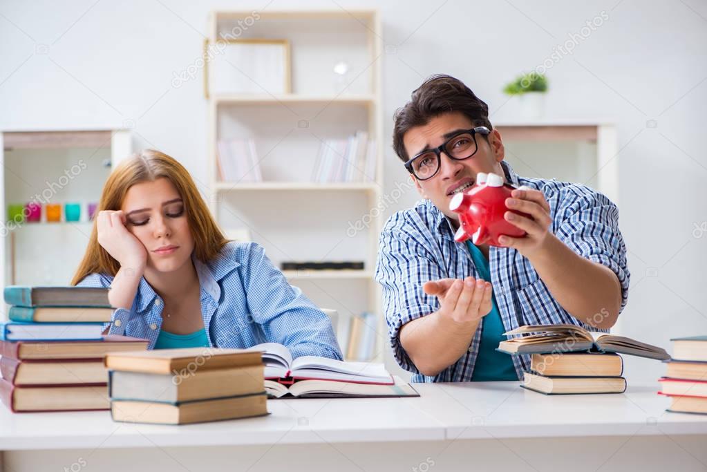 Two students checking savings to pay for education