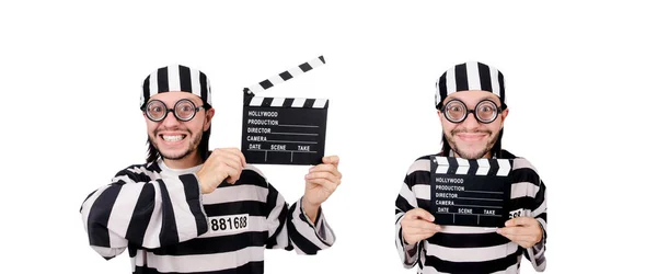 Funny prison inmate with movie board isolated on white — Stock Photo, Image