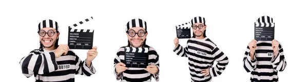 Funny prison inmate with movie board isolated on white — Stock Photo, Image