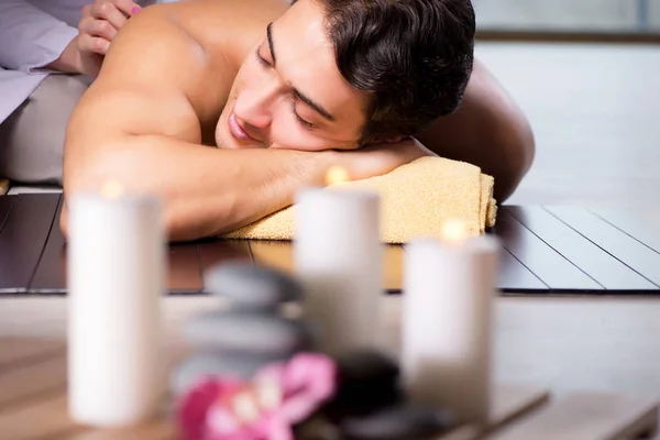 Young handsome man during spa procedure — Stock Photo, Image