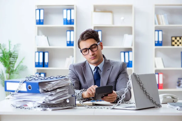 Busy employee chained to his office desk