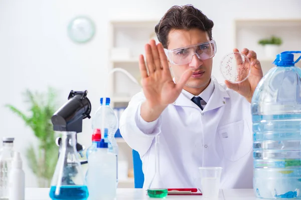 Lab assistant testing water quality