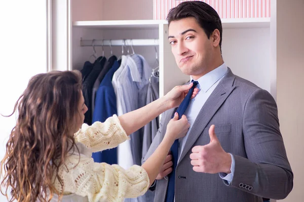 Wife helping husband to get dressed up — Stock Photo, Image