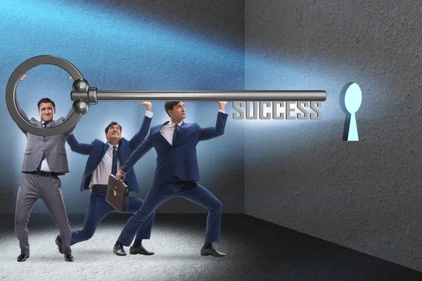 Businessmen in business success concept with key — Stock Photo, Image