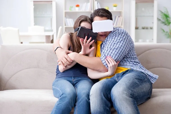 Young family playing games with virtual reality glasses