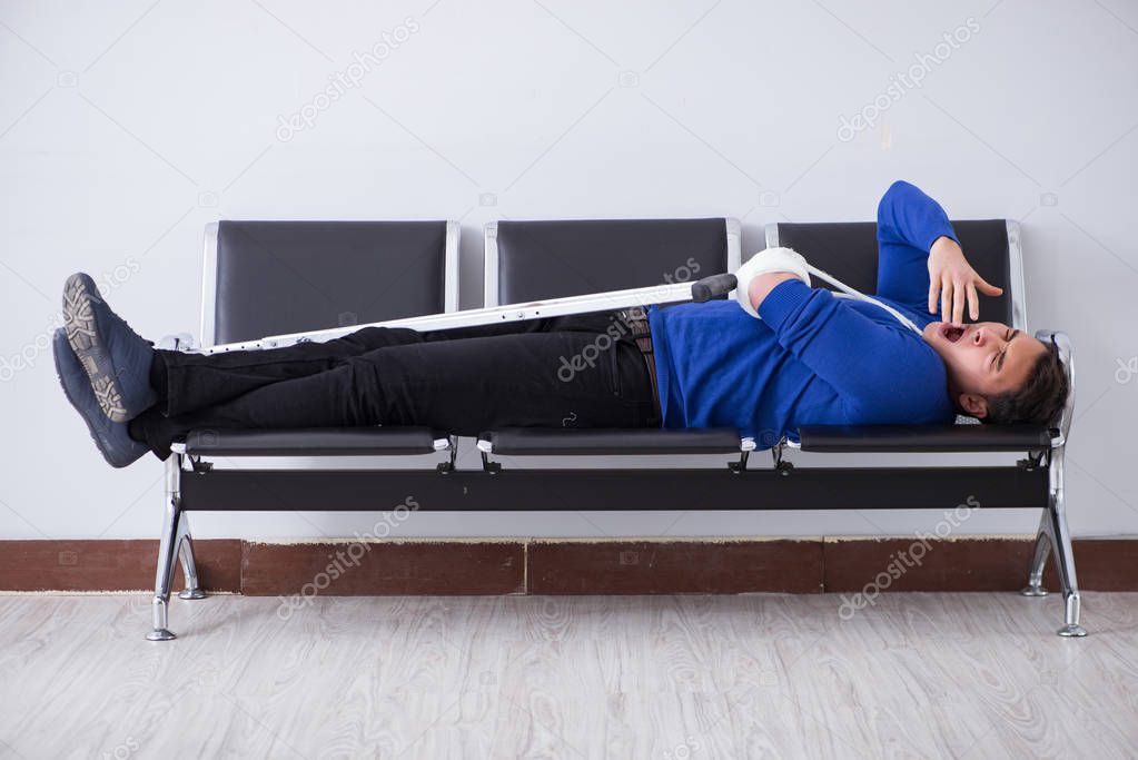 Desperate man waiting for his appointment in hospital with broke