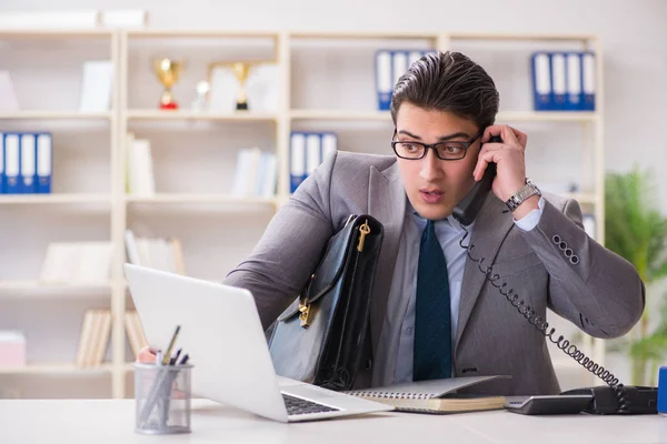 Businessman employee talking on the office phone — Stock Photo, Image