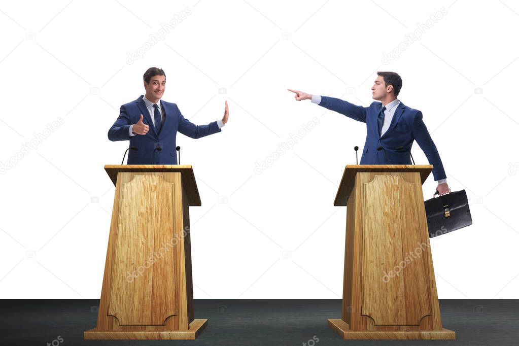 Two businessmen having heated discussion at panel discussion