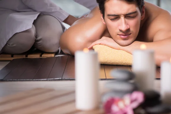 Young handsome man during spa procedure — Stock Photo, Image