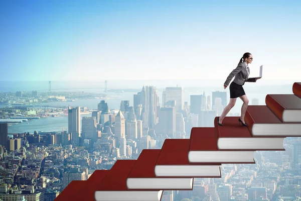 Businesswoman student climbing the ladder of education books — Stock Photo, Image