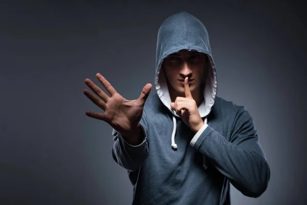 Young man wearing hoodie pressing virtual buttons — Stock Photo, Image