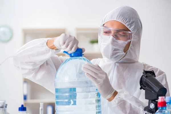 Lab assistant testing water quality