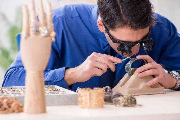 Jeweler working with luxury jewelry in the workshop