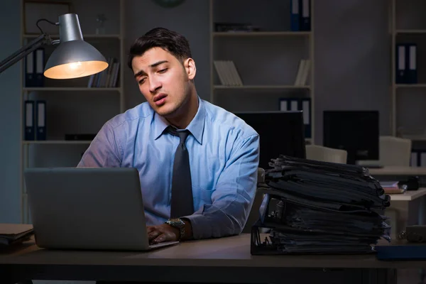 Employee working late at night at important report — Stock Photo, Image
