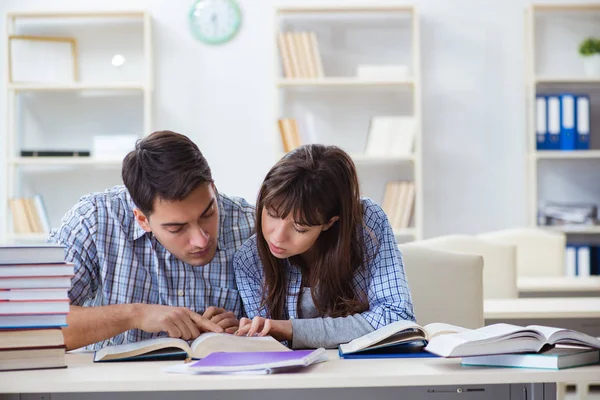 Students sitting and studying in classroom college Stock Image