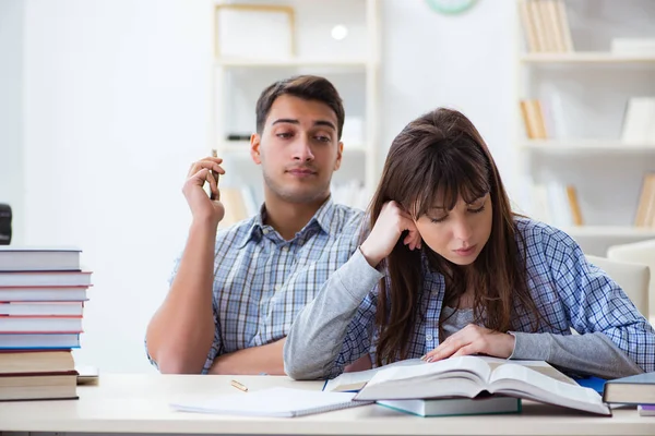 Students sitting and studying in classroom college Stock Picture