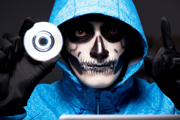 Scary hacker hacking security firewall late in office