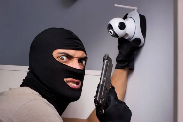 Burglar wearing balaclava mask at crime scene — Stock Photo, Image
