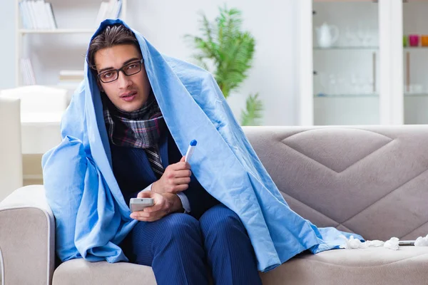 Employee businessman watching tv while being sick with flu — Stock Photo, Image