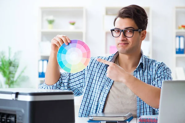 Young designer choosing colours for new project — Stock Photo, Image