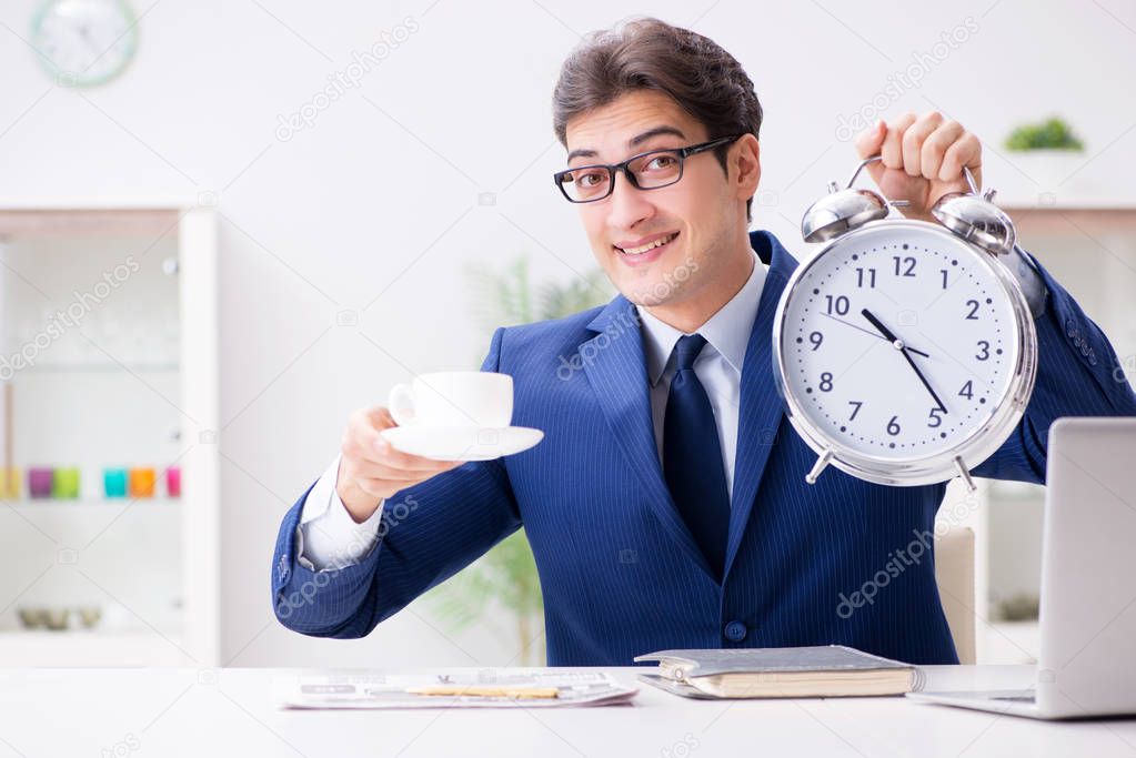 Businessman employee in urgency and deadline concept with alarm 