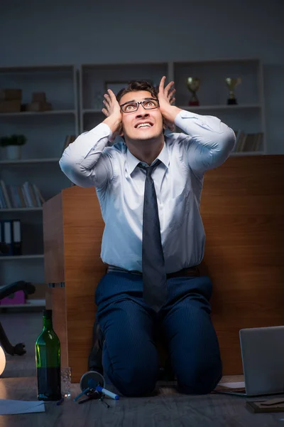 Stressed businessman working overtime in depression