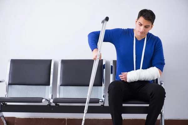 Desperate man waiting for his appointment in hospital with broke — Stock Photo, Image