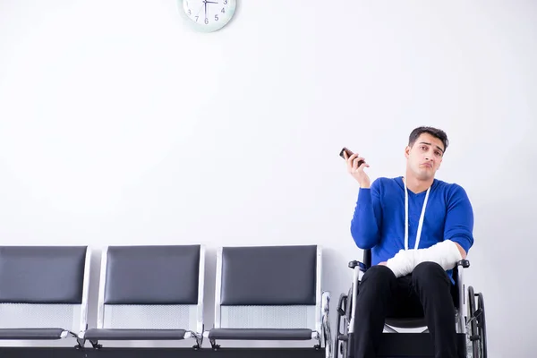 Desperate man waiting for his appointment in hospital with broke