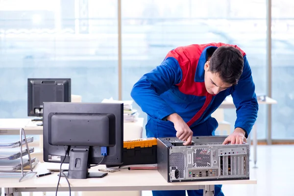 Computer repairman specialist repairing computer desktop