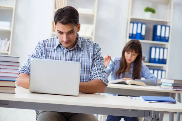 Students sitting and studying in classroom college — Stock Photo, Image